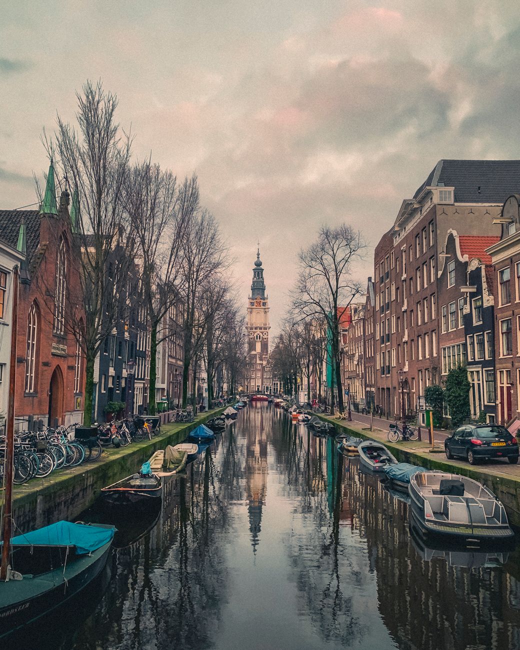 scenic view of amsterdam canal with historic zuiderkerk